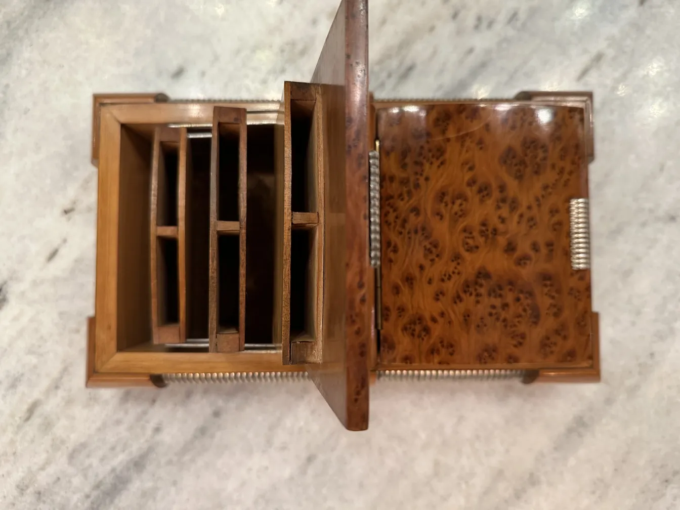 Antique wooden box with compartments for organization in brown tones and detailed carvings. Perfect for storing small items.