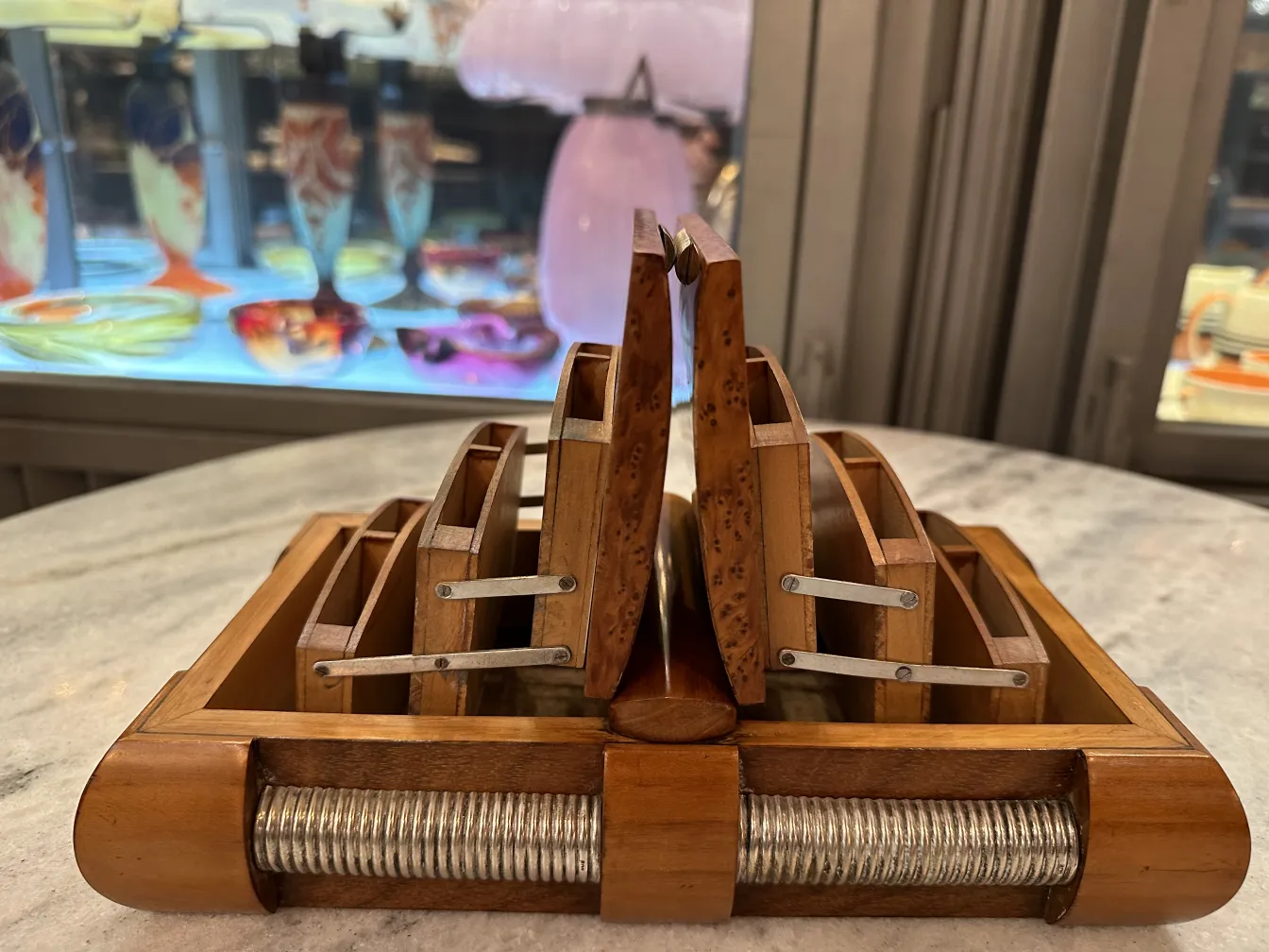 Antique wooden box with compartments, perfect for organizing files. Colorful glass background.