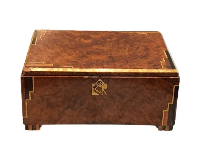 Antique wooden box with elegant design and gold accents.