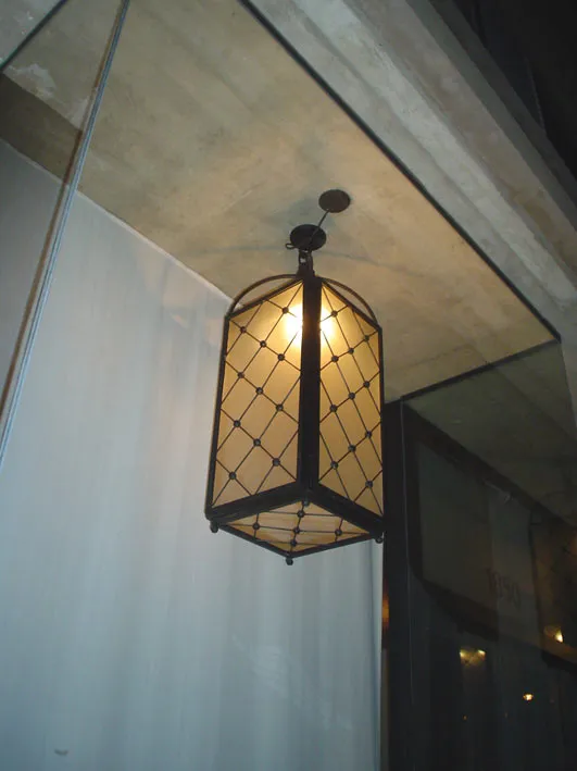 Antique ceiling lanterns with warm light, elegant design.