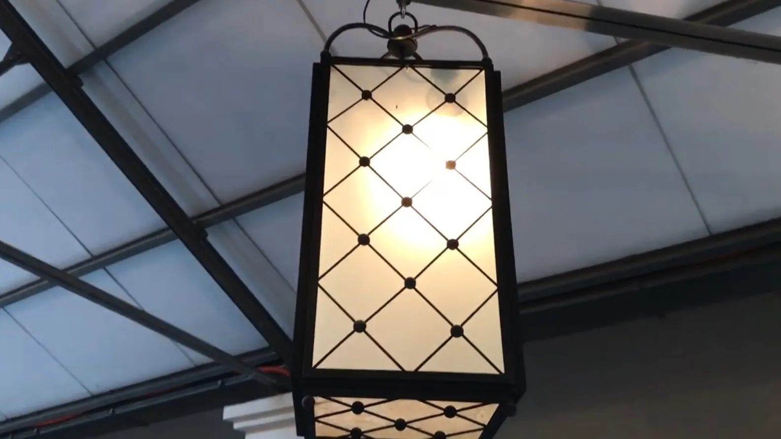 Lantern featuring an antique design with a soft light, perfect for decoration.