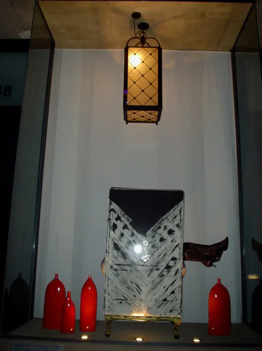 Two antique ceiling lanterns in an elegant setting.