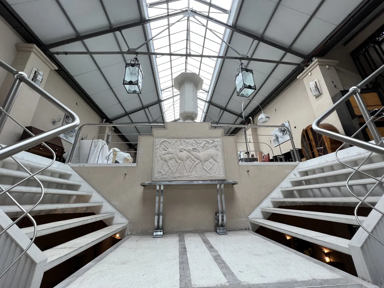 Antique hanging lanterns in a stylish setting with stairs.