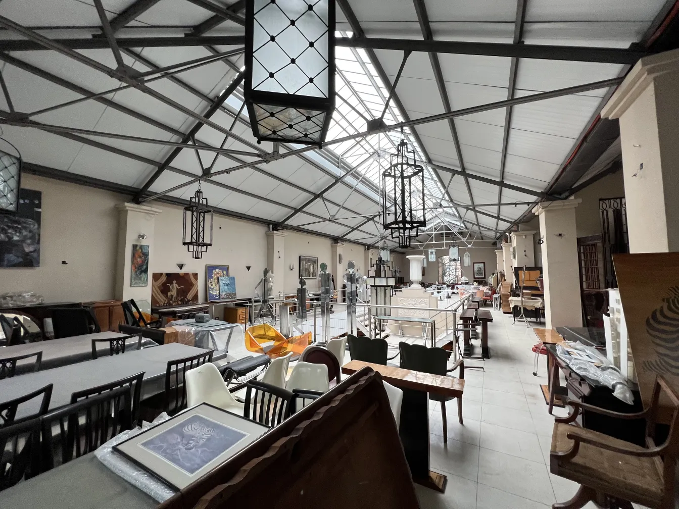 Two decorative antique lanterns in an antique setting.