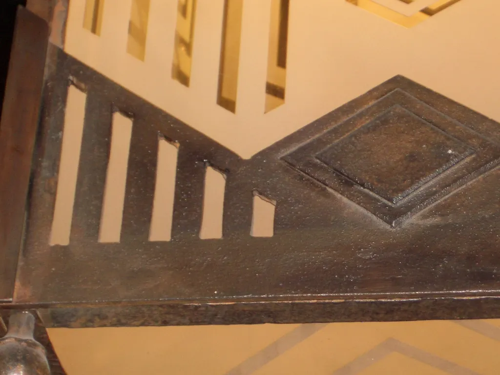 Two antique iron lanterns with geometric design, decorative.