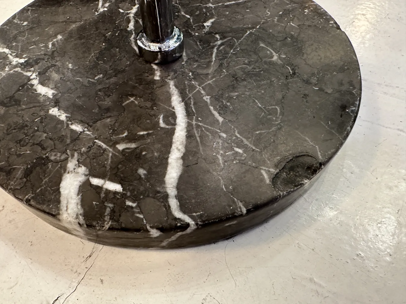 Antique champagne cooler with black marble base, elegant for decor