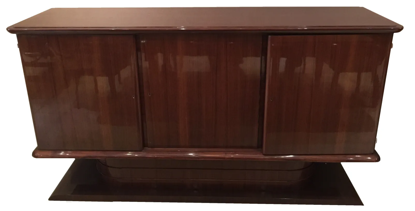 Antique sideboard with smooth doors and shiny finish.
