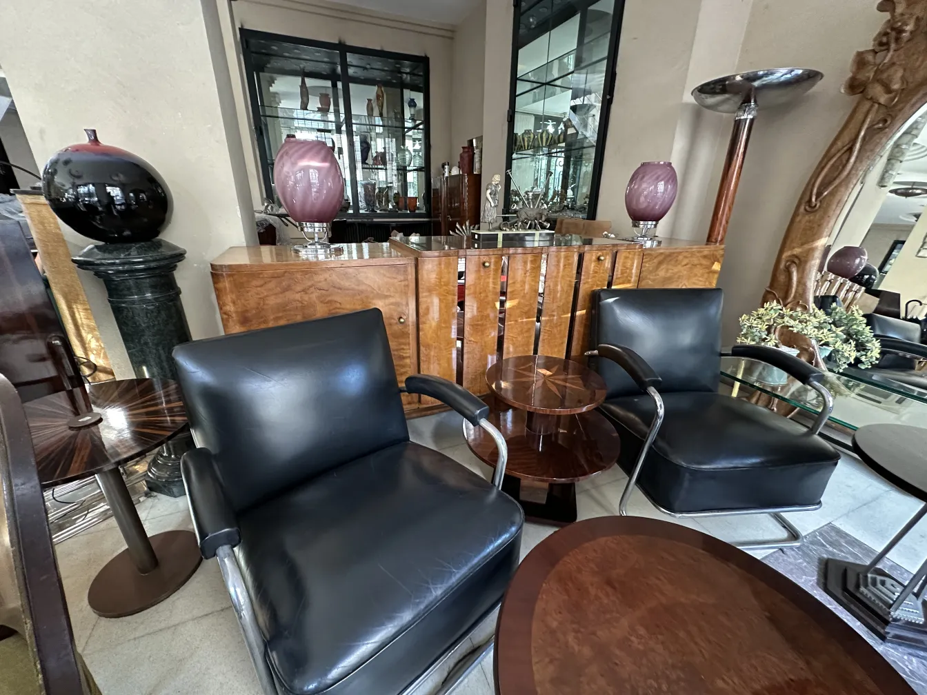 antique sideboard in an elegant setting with chairs