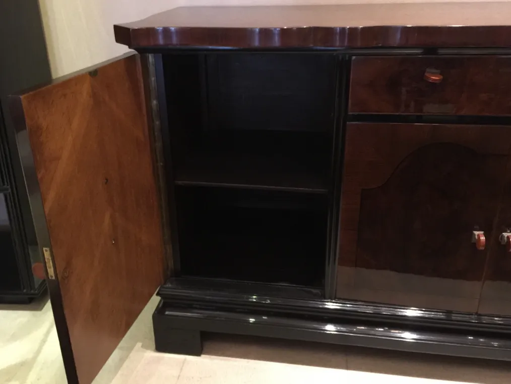 Antique sideboard featuring a visible inner shelf and classic design.