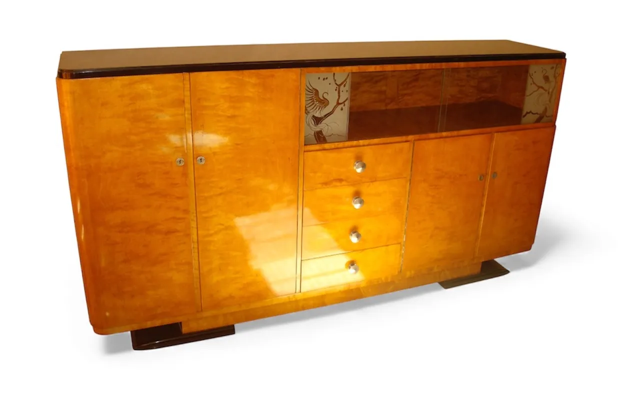 Antique sideboard with cabinets and drawers, elegant setting.