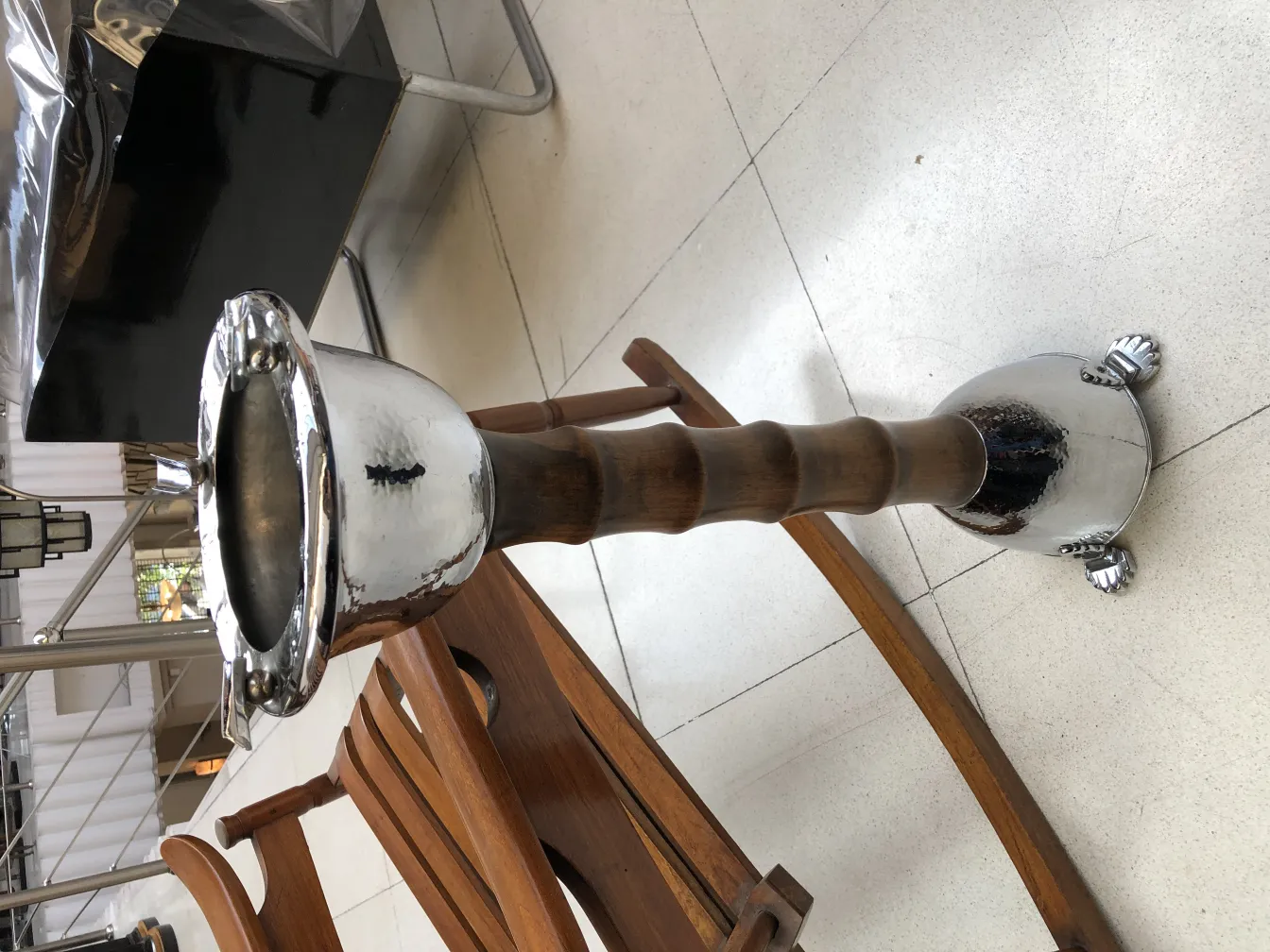 Antique standing ashtray with shiny decoration and attractive base.