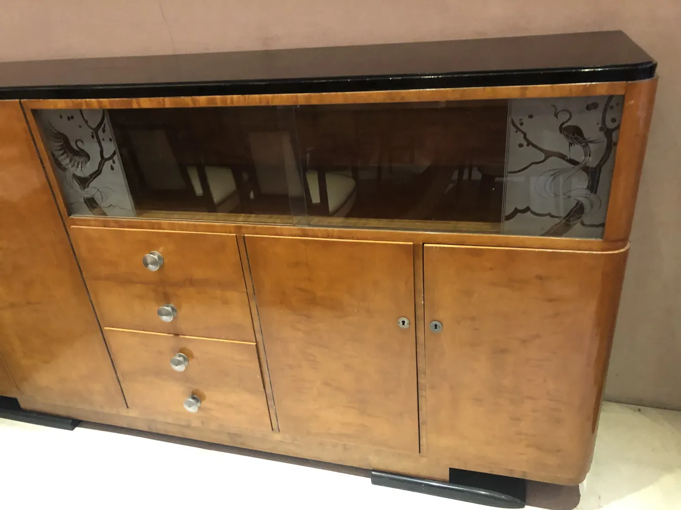 Antique bookcase featuring artistic details and elegant design