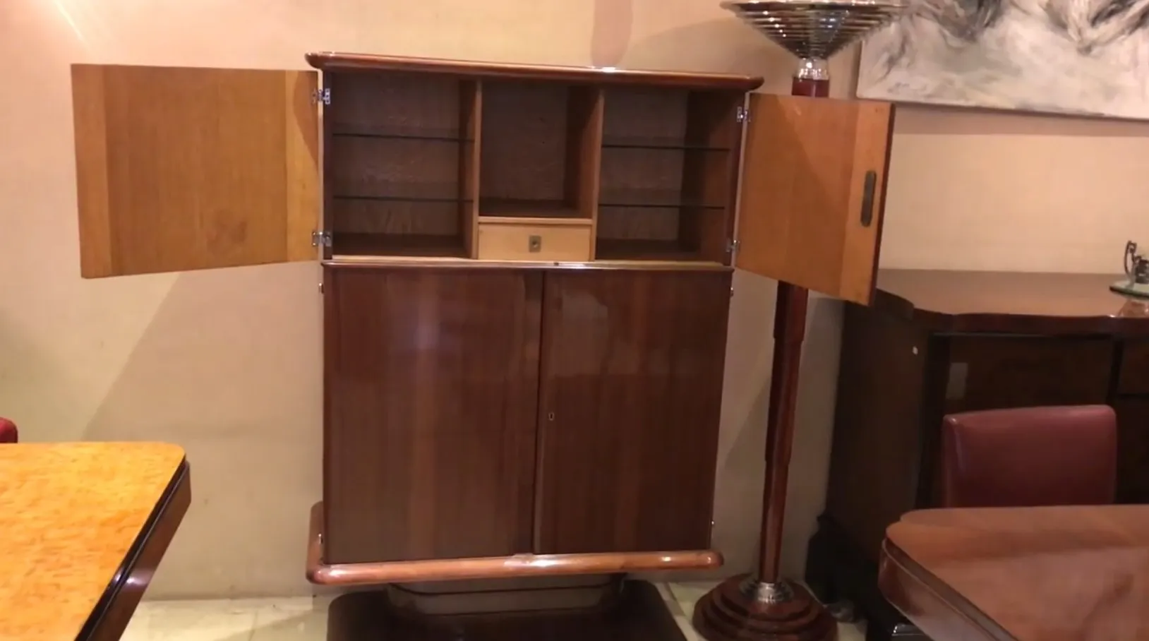 Antique bookcase with visible shelves and doors. Cozy atmosphere.