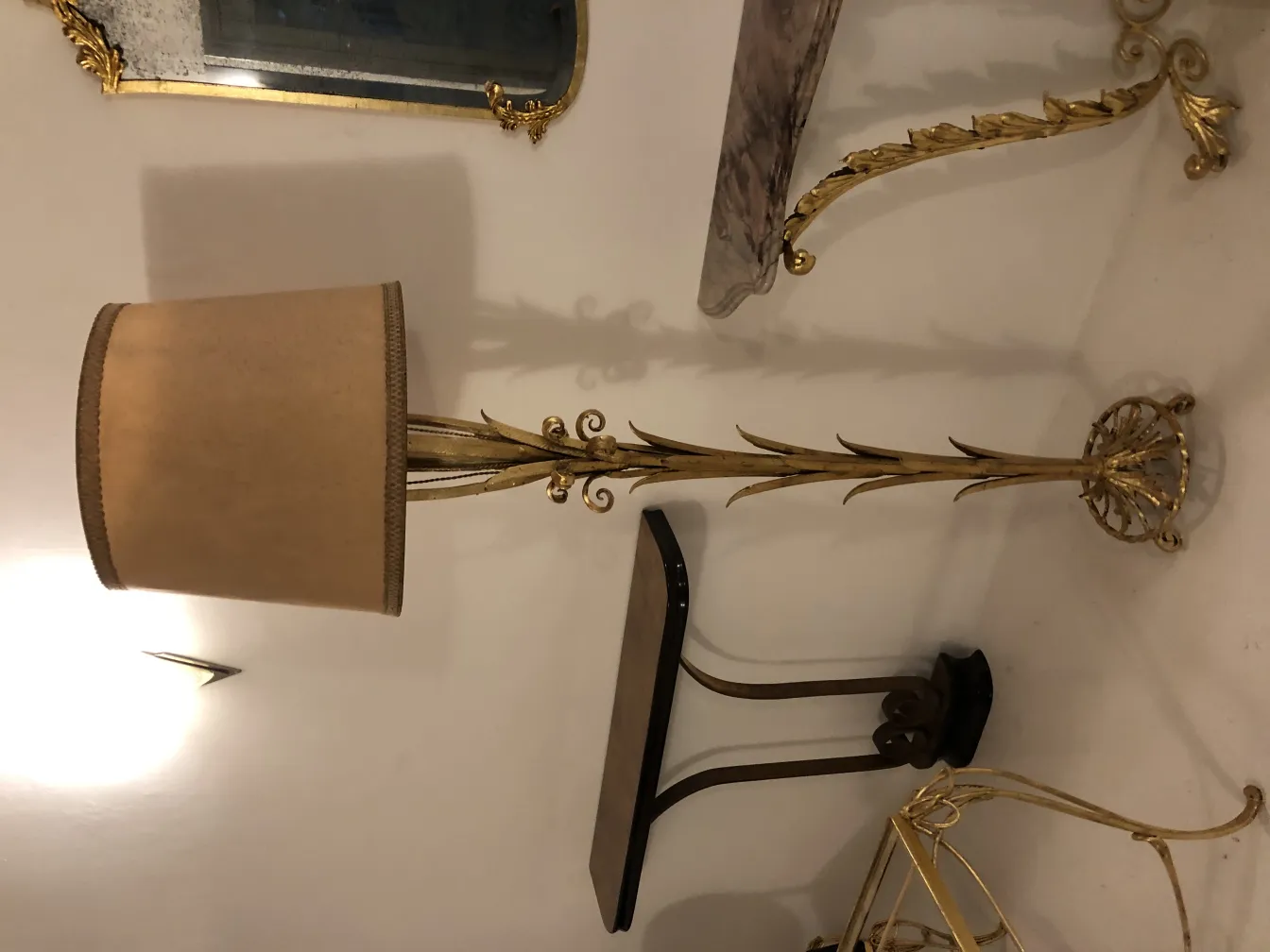 antique floor lamp with floral design and beige shade in an elegant setting