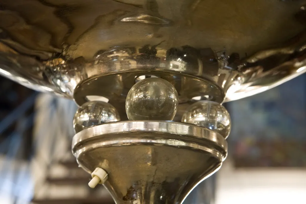 Antique floor lamp with sphere details, elegant setting