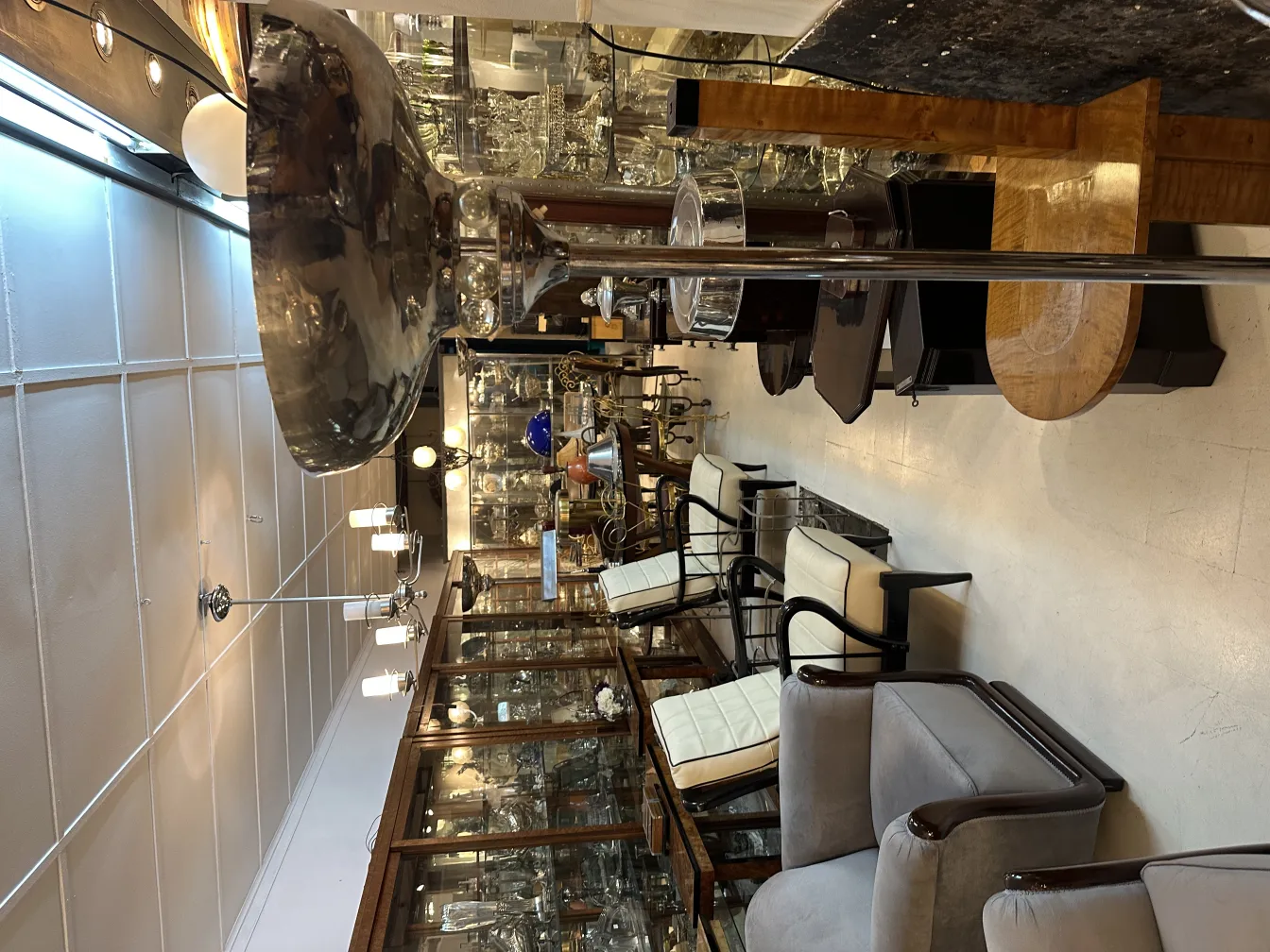 Shiny antique floor lamp in a classic furniture setting.