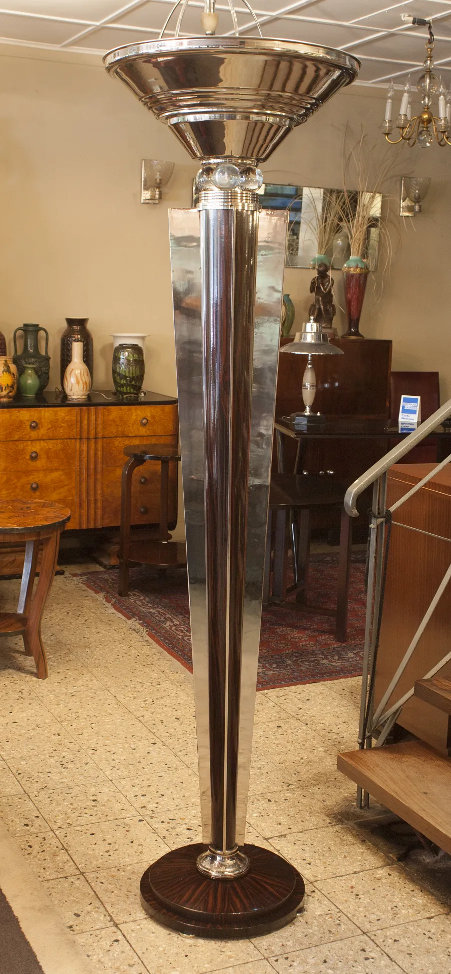 two antique floor lamps with elegant base in a vintage setting.