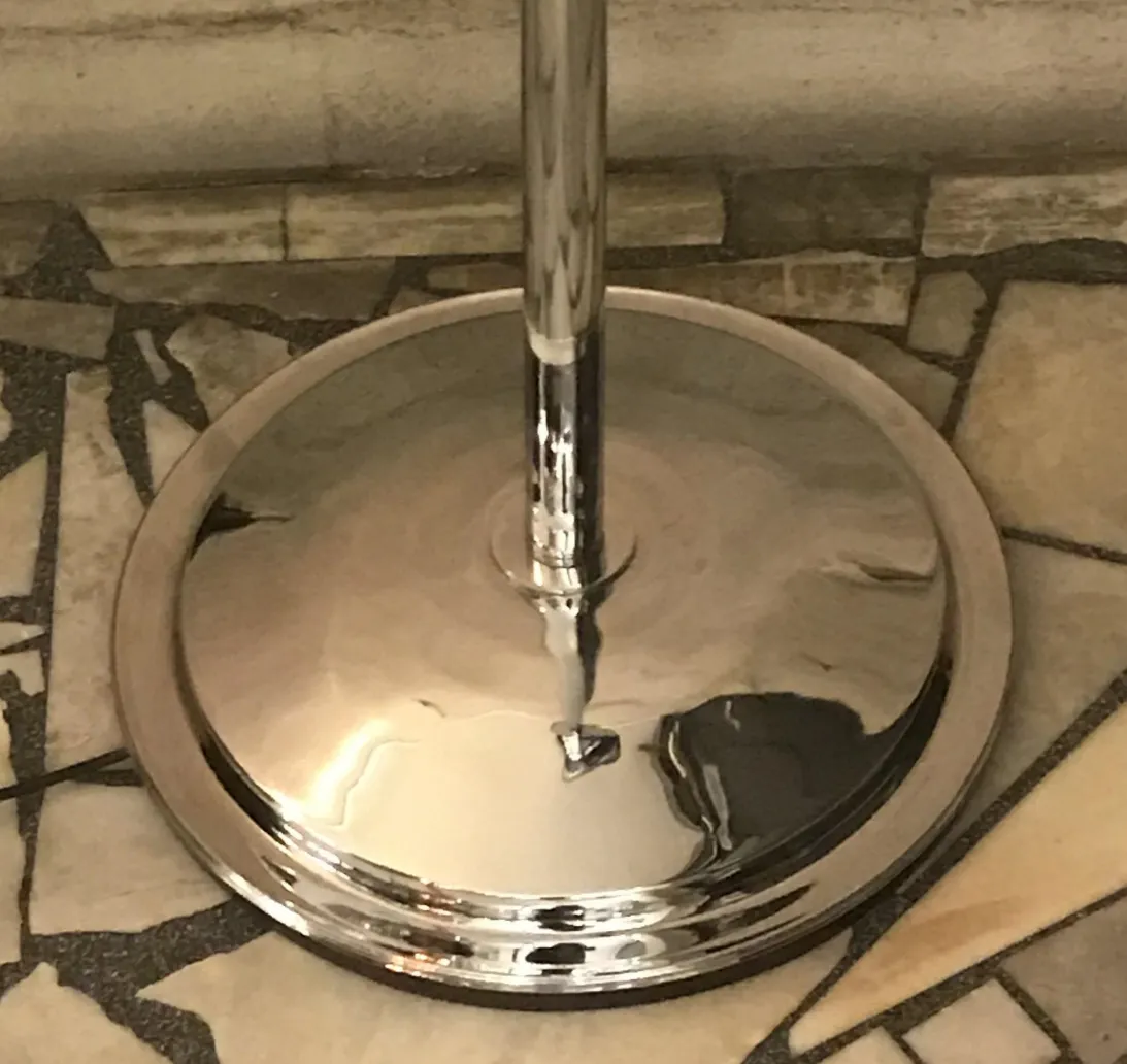 detail of 2 antique floor lamps, highlighting the shiny base