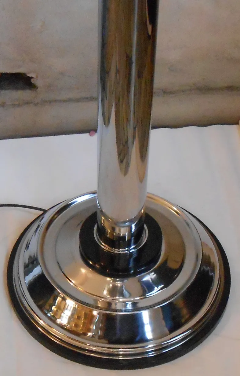 Set of two antique floor lamps with shiny base in a classic setting