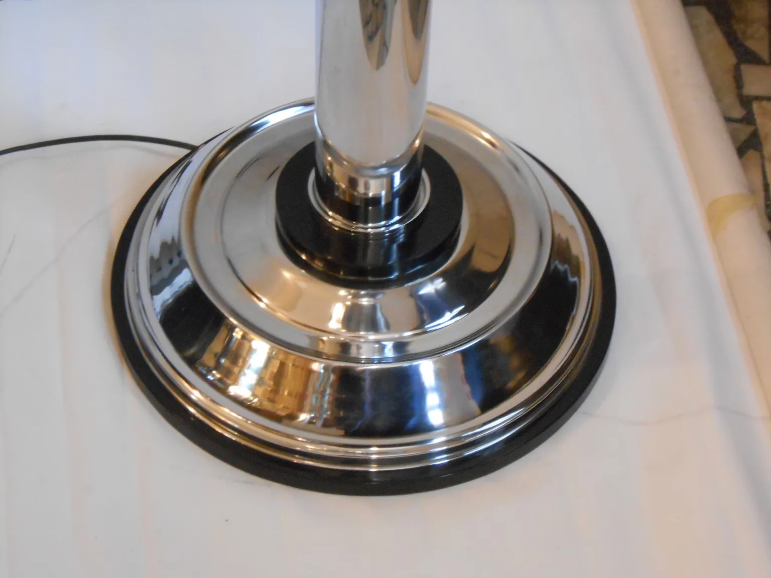 shine base view of two antique floor lamps in neutral setting