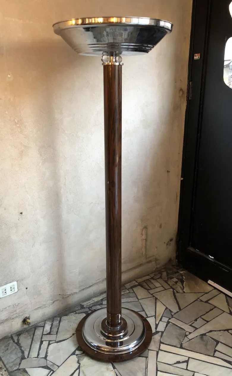 two antique floor lamps with an elegant round base