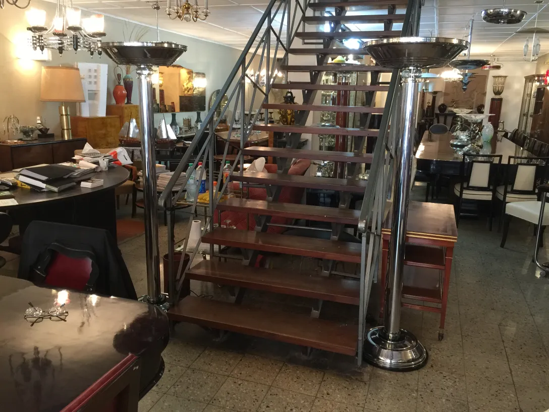 View of two antique floor lamps in a decorative setting.