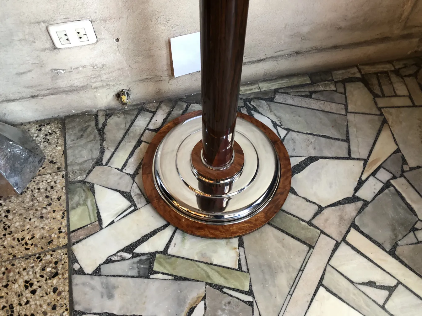 two antique floor lamps with a classic design base, in a cozy setting.