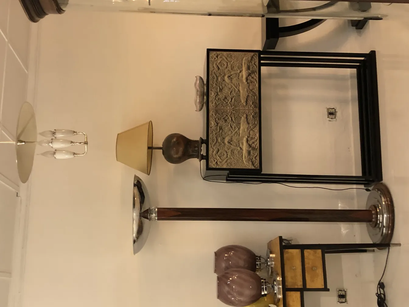 two antique floor lamps in an elegant decor setting
