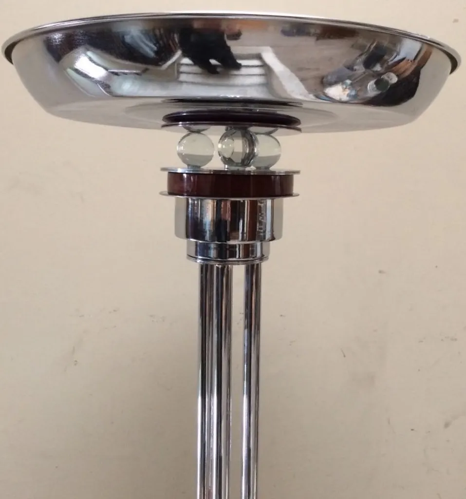 Set of 2 antique floor lamps showcasing a shiny finish.