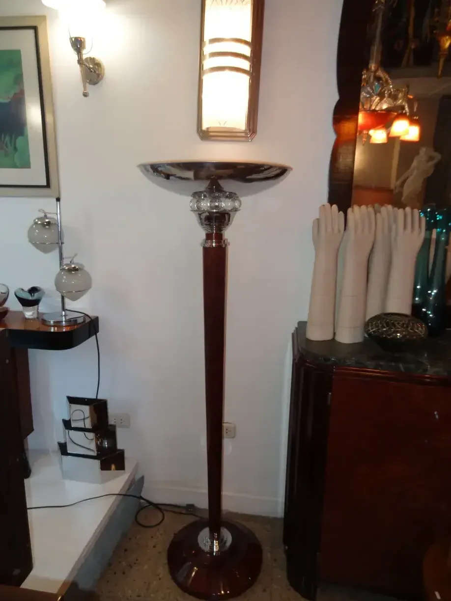 Two antique floor lamps in an elegant setting.