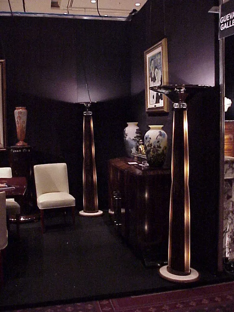 Antique floor lamps illuminating a cozy environment in the exhibition.