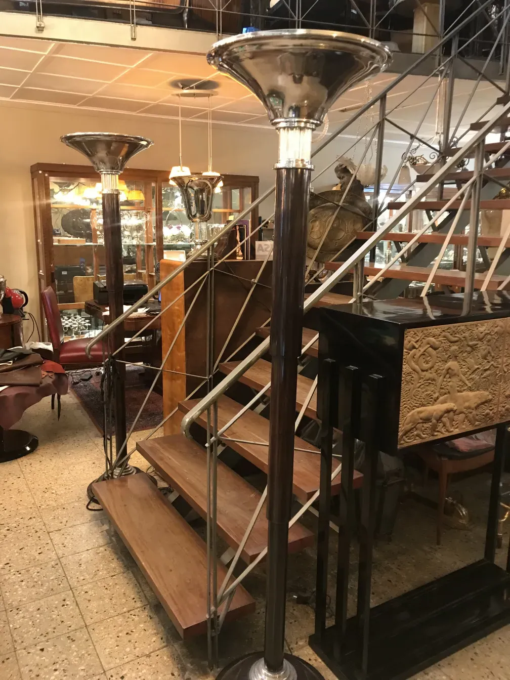 Two elegant antique floor lamps in a cozy setting