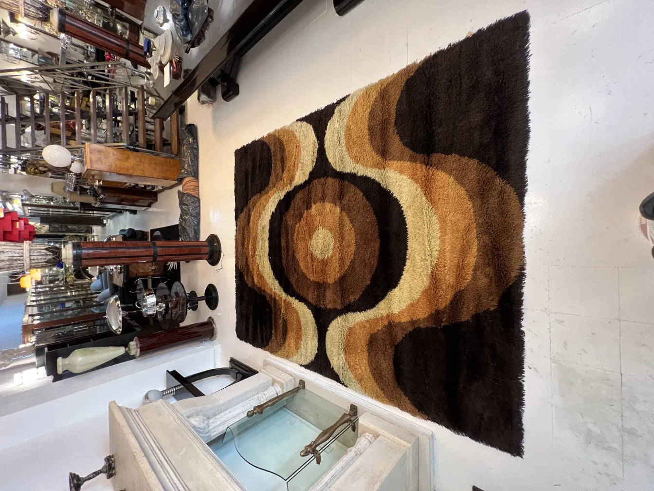 antique carpet with brown and beige design in a room setting