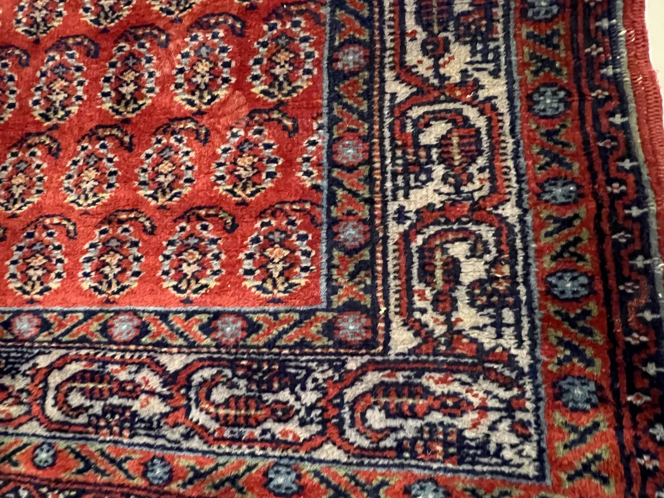 antique carpet with colorful intricate pattern