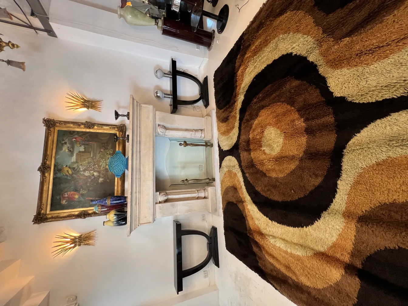 antique carpet with brown and beige colors on the floor