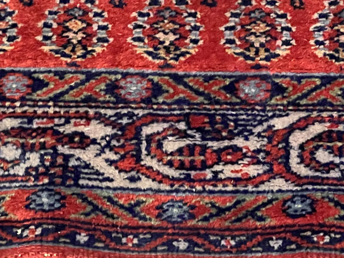 antique carpet featuring vibrant patterns