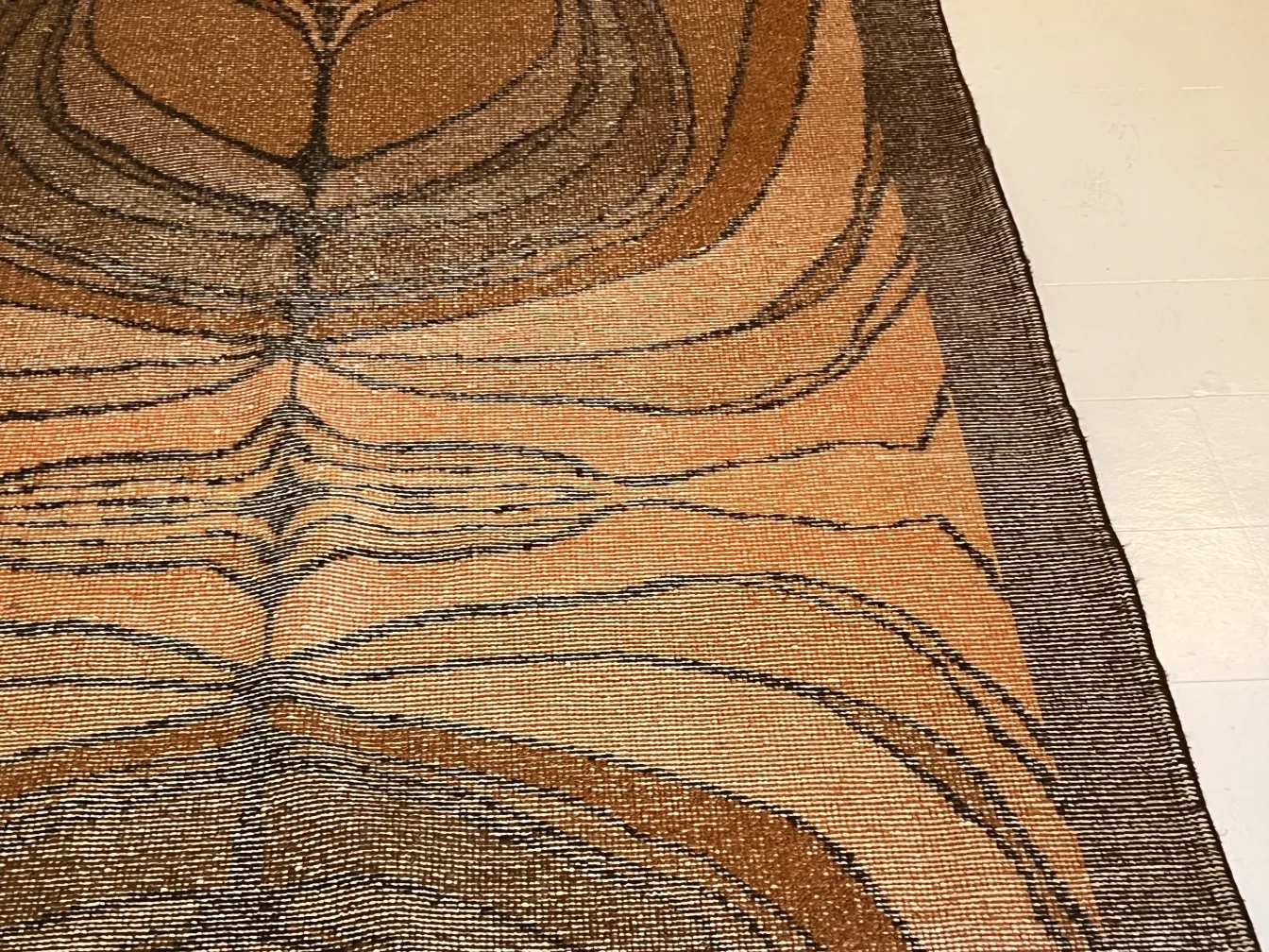 antique carpet featuring geometric design in browns