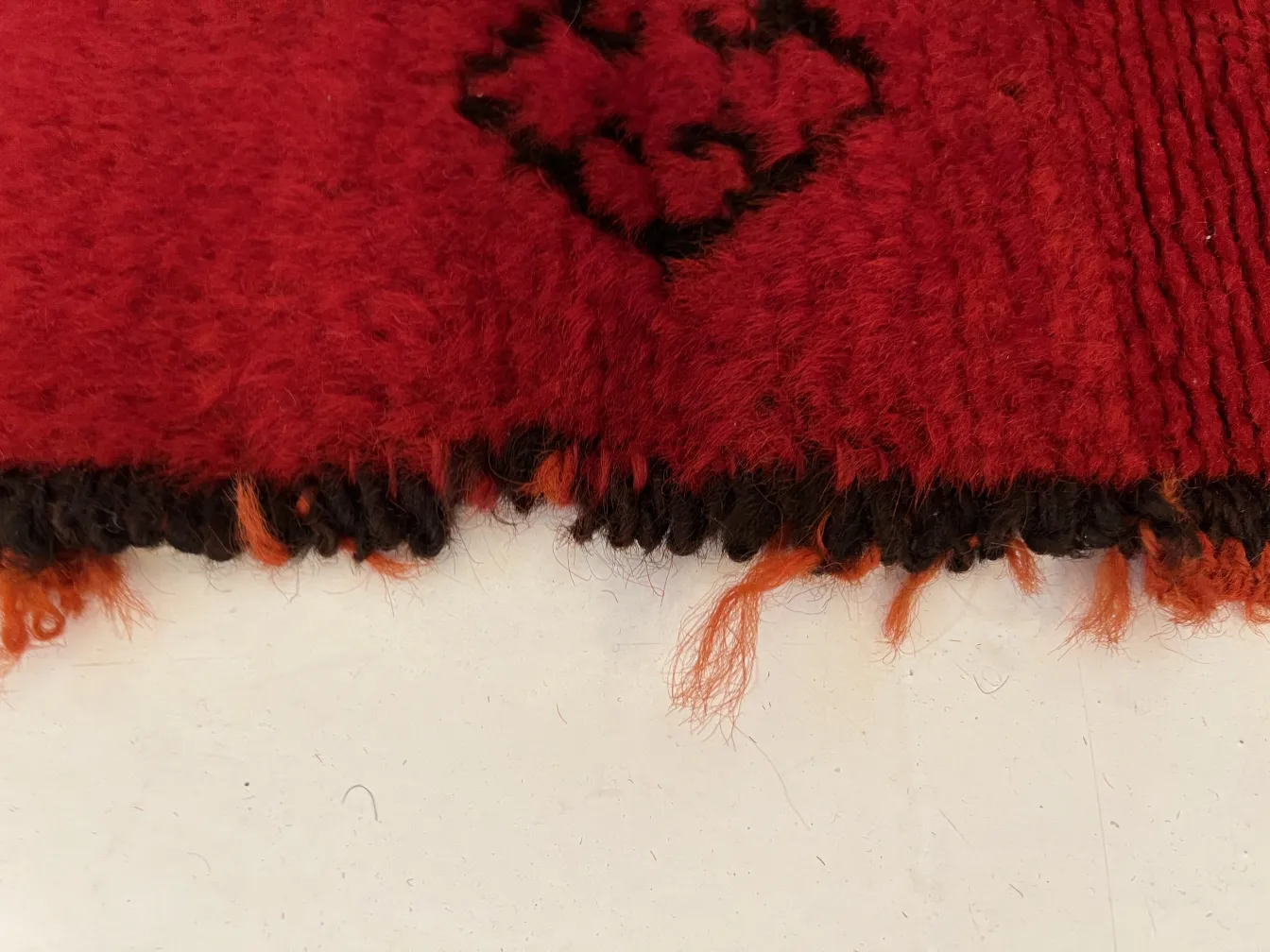 antique red carpet with colorful edges