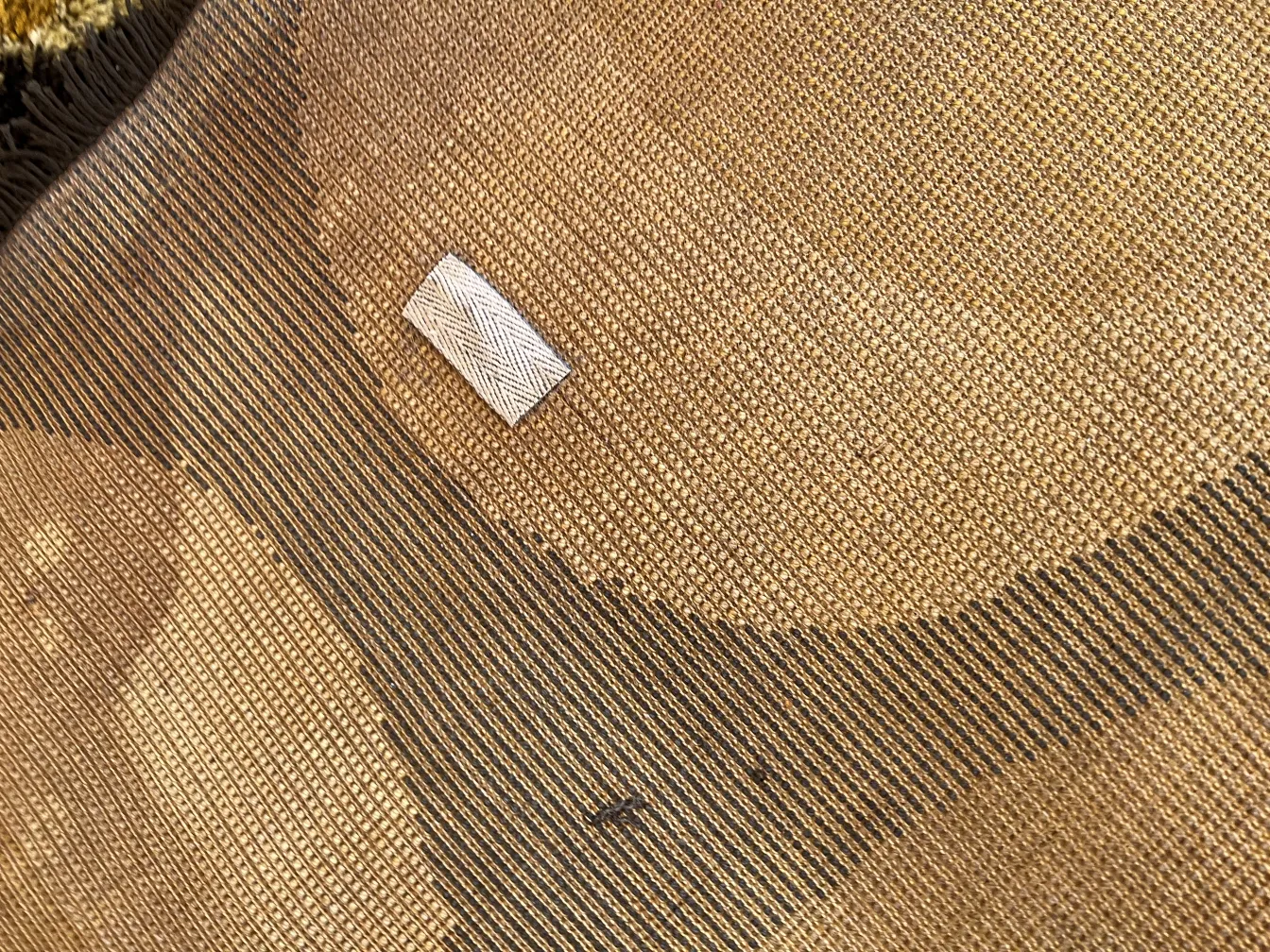 Ancient carpet with natural texture, soft background and clear detail