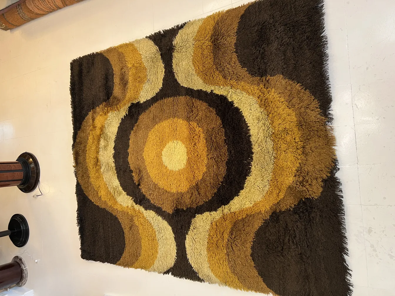 antique carpet with brown and yellow patterns