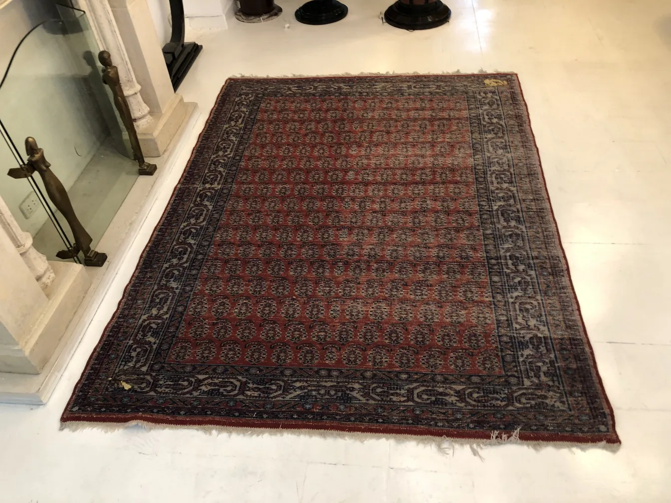 antique carpet featuring traditional design and visual details
