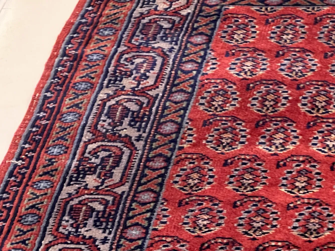 antique red carpet with intricate patterns