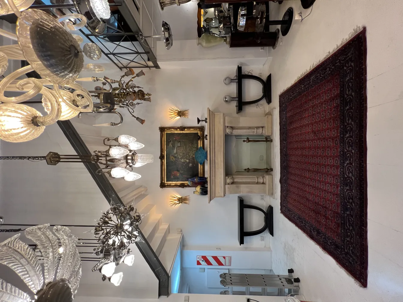 antique carpet with red design and patterns, in an elegant setting