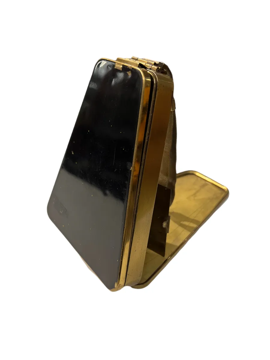 Bolsa antiga Art Deco em preto e dourado.