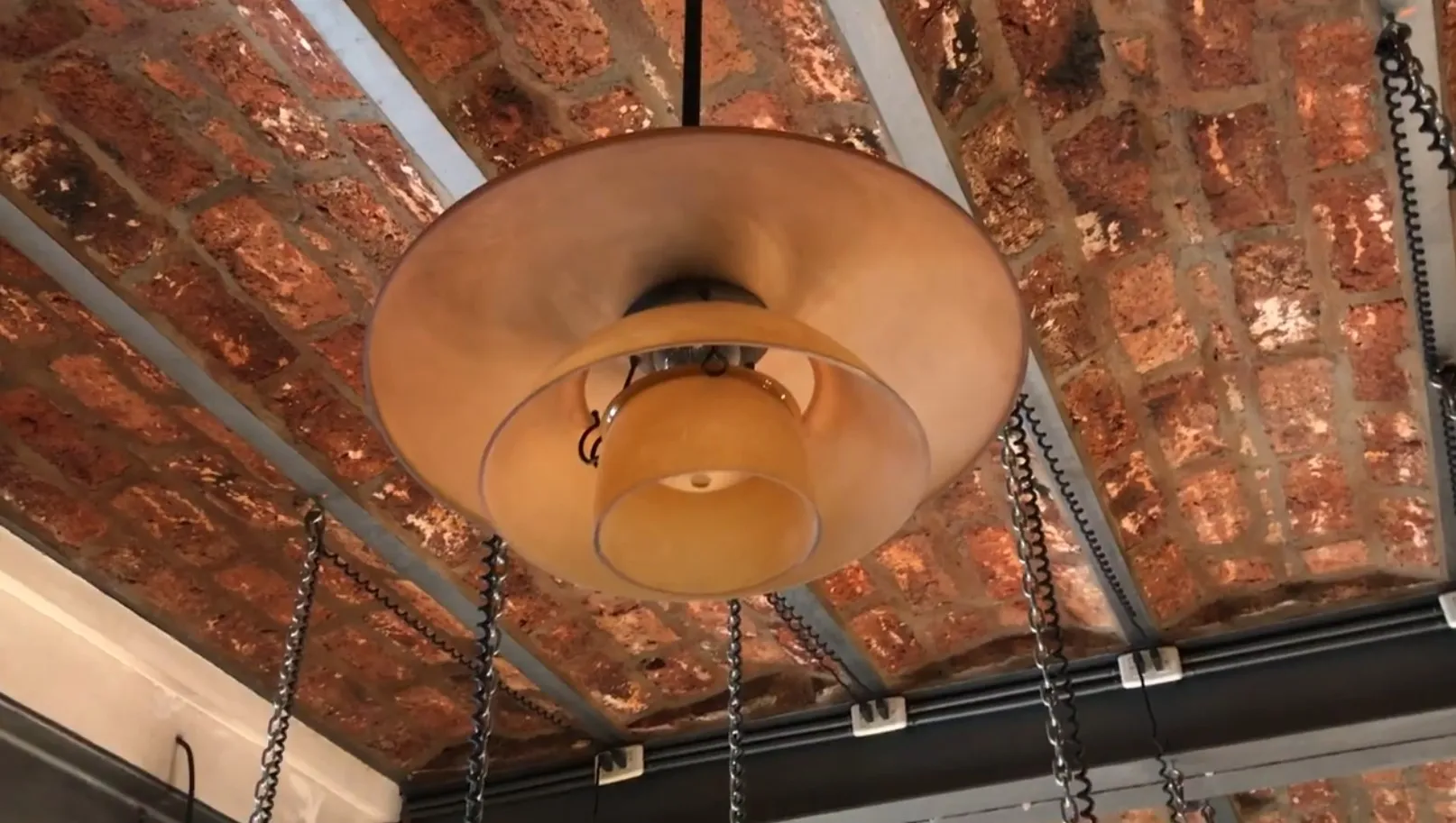 View of two antique hanging lamps with traditional finish