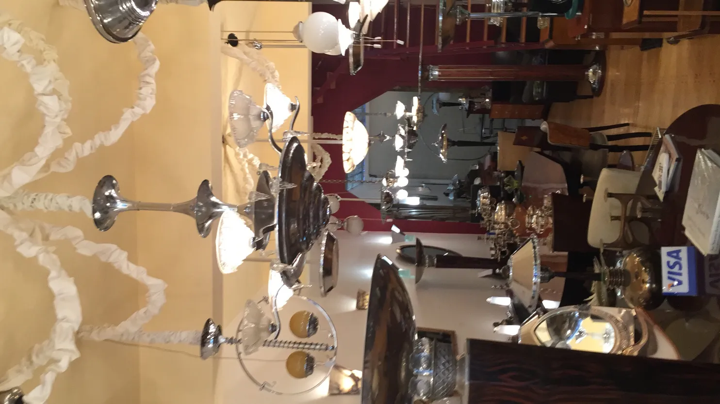 Two antique hanging lamps in a decorative setting