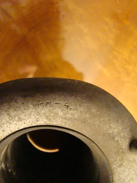 Two antique hanging lamps with decorative details in a cozy setting.