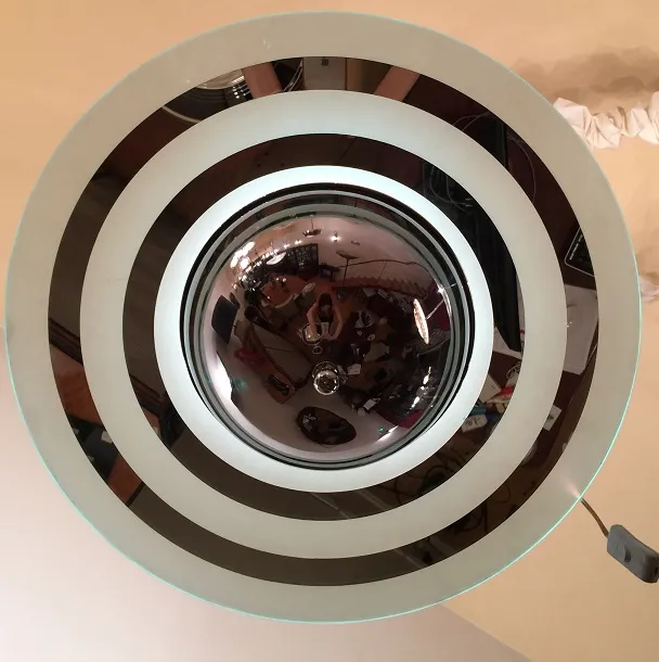 Top view of vintage hanging lamps with circular design and visible reflections