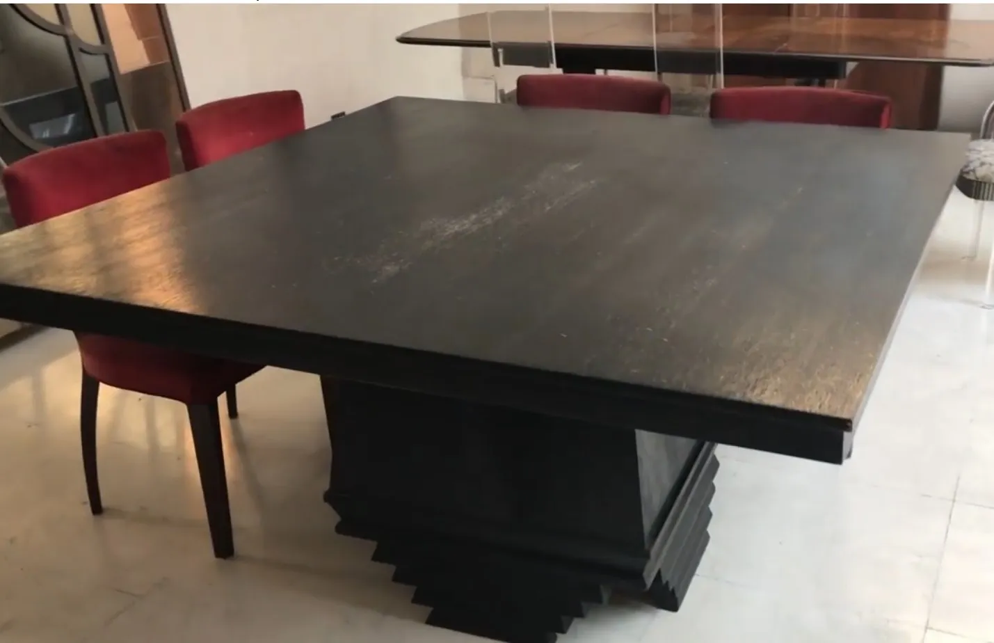 Antique dining table for eight people with red chairs