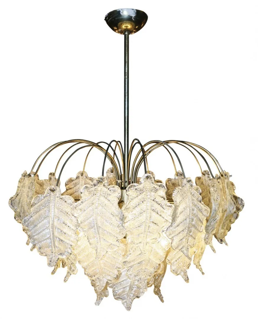 Two antique hanging lamps shaped like leaves, adding a natural touch to the setting.